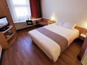 Кровать или кровати в номере Ibis Bratislava Centrum +61 фотография