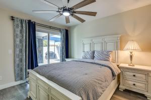 a bedroom with a bed and a ceiling fan at 3 Mi to Desert Diamond Arena Peoria Home with Yard! in Shamrock Mobile Home Park