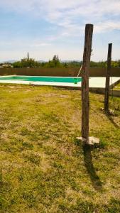 a boat sitting in a field next to a pole at Casa Tanti in Tanti