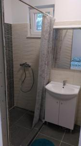 a bathroom with a shower and a sink at Apartment Julie 4 in Rijeka