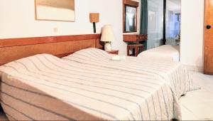 Ένα ή περισσότερα κρεβάτια σε δωμάτιο στο Ocean view Cerro Branco with pool +7 φωτογραφίες