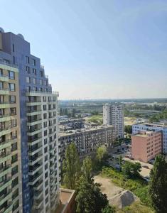 an aerial view of a city with tall buildings at Amazing view-18th floor-2 bedrooms flat - free parking in Trnávka +12 photos