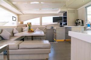 a kitchen and living room of a recreational vehicle at Leopard 51' in La Paz
