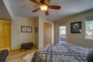 a bedroom with a bed and a ceiling fan at Mtn-View Deck at Home 7 Mi to Tonto Natural Bridge in Pine