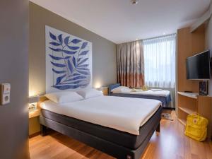 Postel nebo postele na pokoji v ubytování ibis Heilbronn City + 148 fotografií