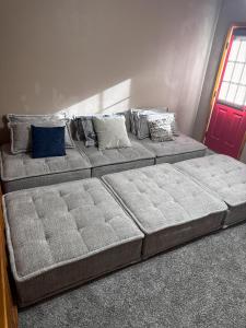 a large bed in a room with pillows on it at Dear Love Cabin in Ruidoso