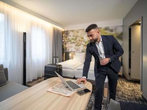 TV a/nebo společenská místnost v ubytování Novotel Suites Wien City Donau