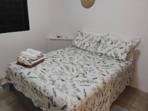a bed with a blanket and a pillow on it at Olinda sítio Histórico Alto da Sé in Olinda