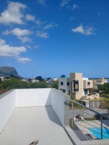 a view from the balcony of a building at Midhan villa in Rivière Noire