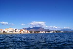 a body of water with a city and mountains in the background at Hotel Doña Luisa in San Luis de Sabinillas