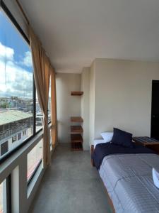 Ένα ή περισσότερα κρεβάτια σε δωμάτιο στο Marina Stella Suites +24 φωτογραφίες