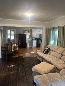 a living room with a couch and a kitchen at Private Cottage in Rural Clemmons in Clemmons