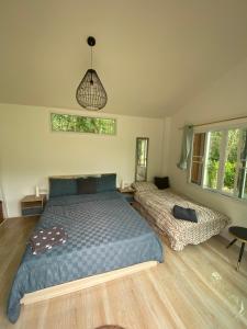 Postel nebo postele na pokoji v ubytování Noi’s Paradise Homestay