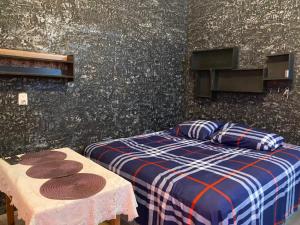 a bedroom with a bed and two tables with hats on it at Bonita habitación a 3 min Del Word Trade Center in Veracruz