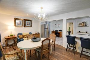 a kitchen and living room with a table and chairs at Updated North Greenwood Cottage Less Than 1 Mi to Dtwn! in Greenwood +21 photos