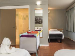 Ένα ή περισσότερα κρεβάτια σε δωμάτιο στο ibis La Bresse Gérardmer +127 φωτογραφίες