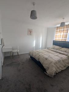 Postel nebo postele na pokoji v ubytování 3SIEE Homes