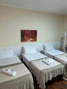Ένα ή περισσότερα κρεβάτια σε δωμάτιο στο Hotel Avenida