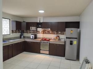 Køkken eller tekøkken på Linda casa en la Playa con piscina