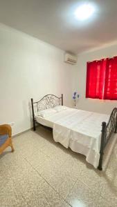 Katil atau katil-katil dalam bilik di Tata Apartamentos