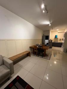 a living room with a couch and a table at 3BR, Palas Horizon Resident near Kea Farm Market in Cameron Highlands