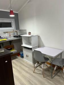 an office with a desk and a table and two chairs at La MERCED 