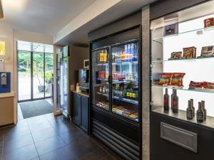 a refrigerator filled with lots of bottles of wine at ibis budget Basel Pratteln in Pratteln