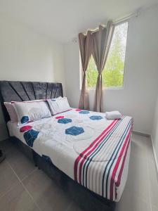 Postel nebo postele na pokoji v ubytování Apartamento Lotus 203 - Cantón militar Jaime Rooke