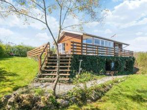 a house with stairs leading up to it at Holiday Home near Loddenhoj Beach in Brøde