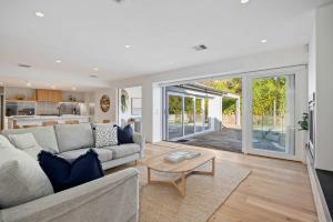 a living room with a couch and a table at Casa del Sol Heated Pool & Spa in Sorrento