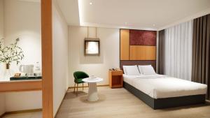 Postel nebo postele na pokoji v ubytování 上海繁花酒店 FLORAL HOTEl + 66 fotografií