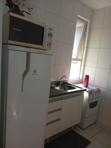 Η κουζίνα ή μικρή κουζίνα στο Apartamento 06 na zona 7