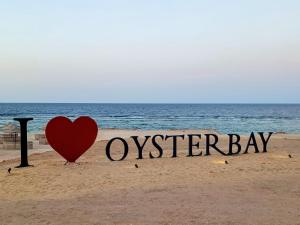 a heart on the beach with the words oyster bay at Oyster Bay Beach Suites K7-14 in Marsa Alam City