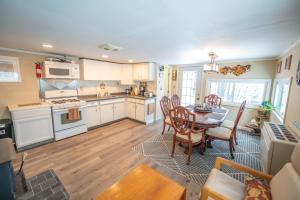 a kitchen and dining room with a table and chairs at The Perch in Abbeyville