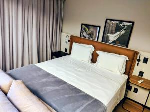 Ένα ή περισσότερα κρεβάτια σε δωμάτιο στο The Capital Flat Luxo Itaim Bibi