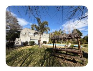 a house with a pavilion in the yard of a yard at Acantilados mar y pileta in Mar del Plata