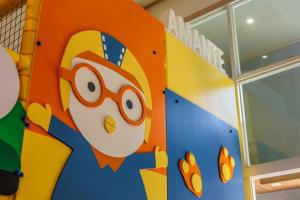 a wall with a cartoon face painted on it at Gapyeong Lukuel Spa Pension in Gapyeong