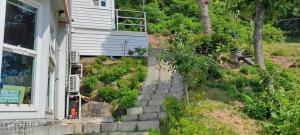 a house with steps leading up to a house at Boseong Deukryangman Pension in Boseong