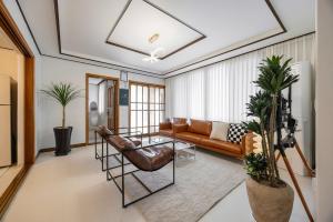 a living room with a couch and a table at Asan Wolang Stay in Asan