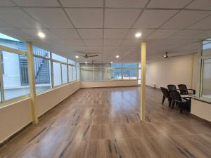 an empty room with chairs and a table in a building at Siddhi Retreat hotel in Rishīkesh