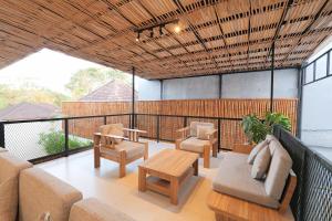 a living room with a couch and chairs and a table at 4BR Modern Villa walking dist to Sidewalk Jimbaran in Jimbaran
