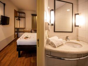 Postel nebo postele na pokoji v ubytování ibis Betim