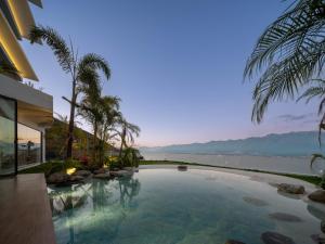 a swimming pool with a view of the ocean at YS Seaview Hotel in Dali +18 photos