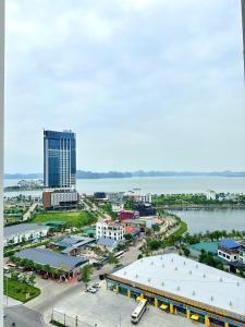 an aerial view of a city with a large building at Thảo Aparment Hạ Long in Ha Long