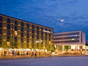 a hotel building with a sign on the side of it at Novotel München Messe in Munich