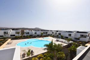 an aerial view of a resort with a swimming pool at Book Jet - Casilla de Costa Dreams in Villaverde