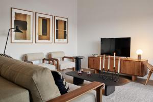 TV a/nebo společenská místnost v ubytování MATT - Apartments ' Penthouse mit Dachterrasse