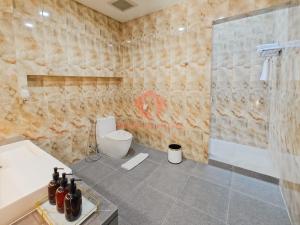 a bathroom with a toilet and a shower and a sink at Luxury 3BR Krobokan Villa B Pool&Wi-Fi in Kerobokan +25 photos