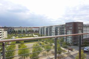 a view of a city from a balcony with buildings at Spacious Studio Apartment Friedrichshain in Berlin