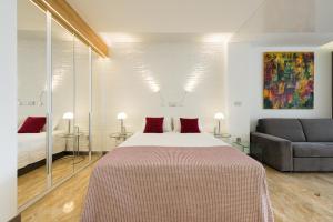 Posteľ alebo postele v izbe v ubytovaní Suites Garden Loft Kandinsky